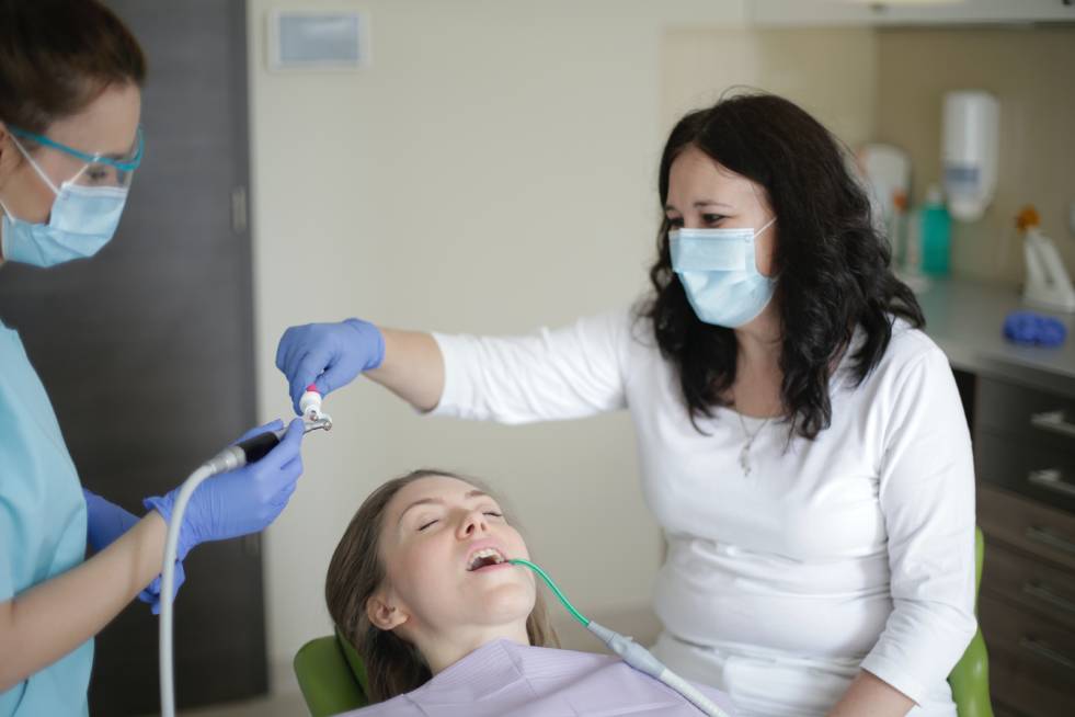 a dentist is treating a patient